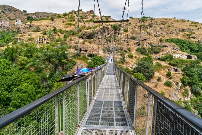 Group Tour: Hin Areni Winery, Tatev (wayback on Ropeway), Khndzoresk Caves - Walking through the caves of Khndzoresk
