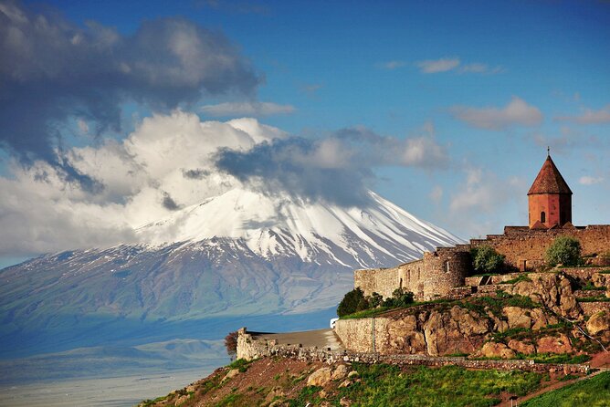 Khor Virap monastery on its mound below the snow line of Mount Ararat